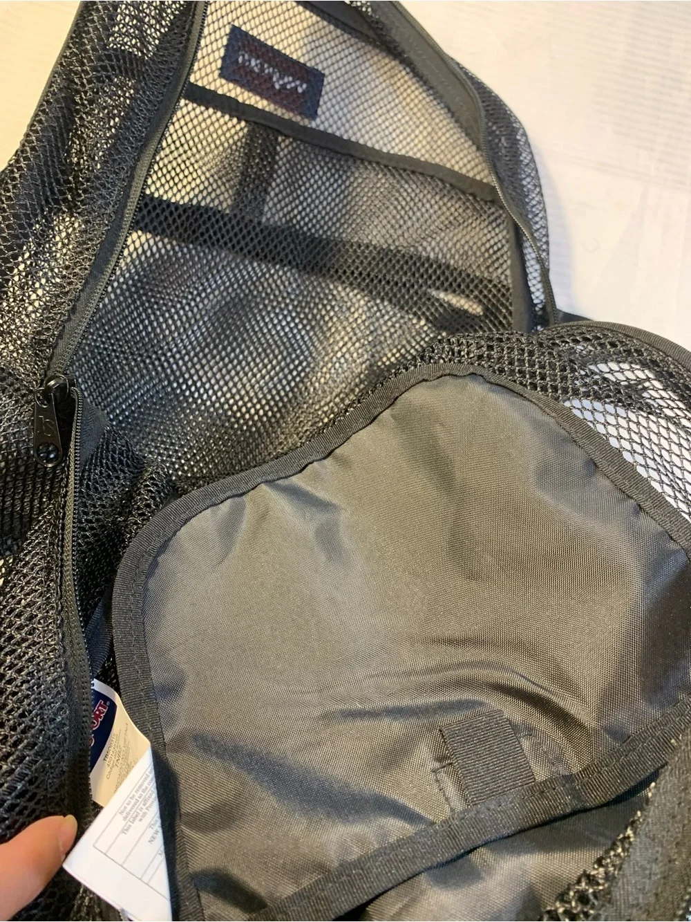 JanSport Mesh Pack Backpack in Black, a semi-trans. EC style TB500315